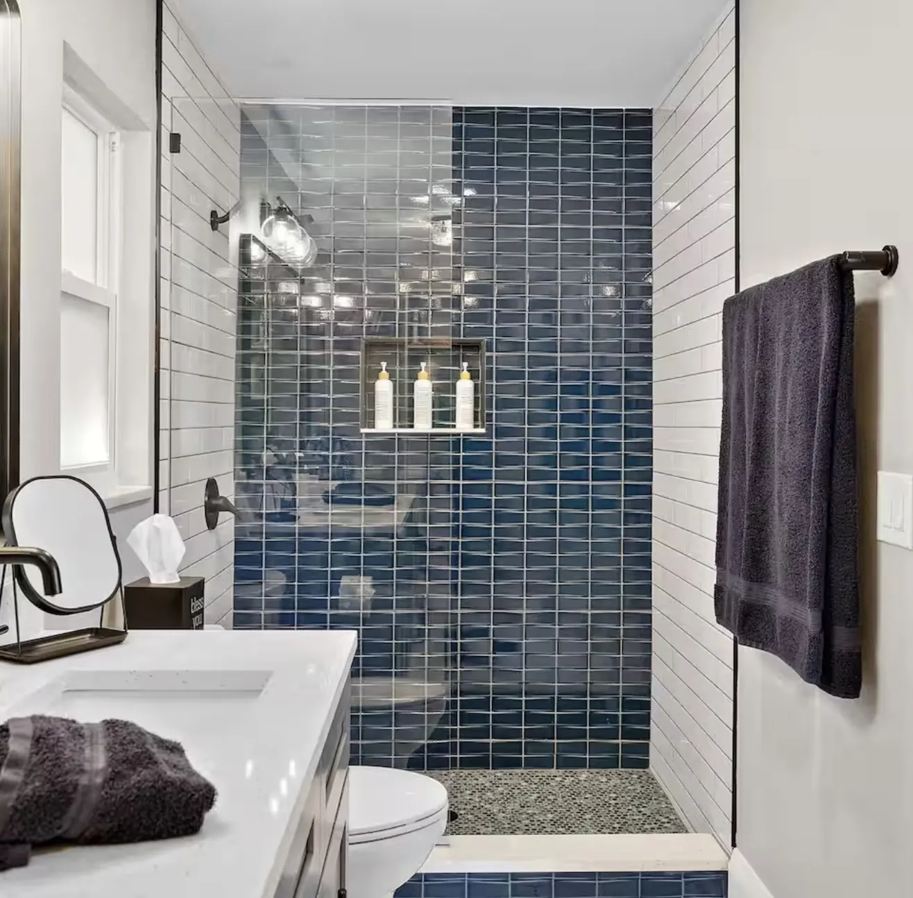 Walk-in shower with tiled niche by CWL Construction