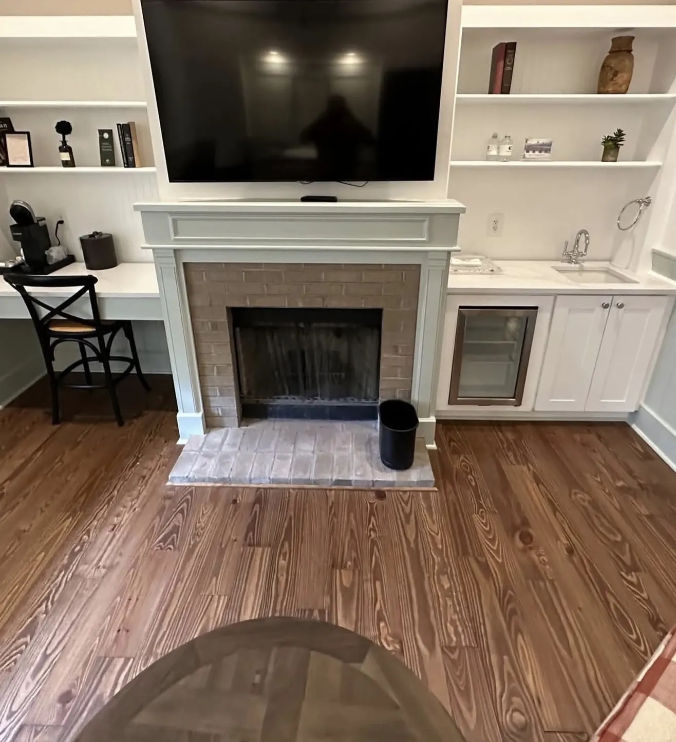 Fireplace surround and built-in shelving by CWL Construction