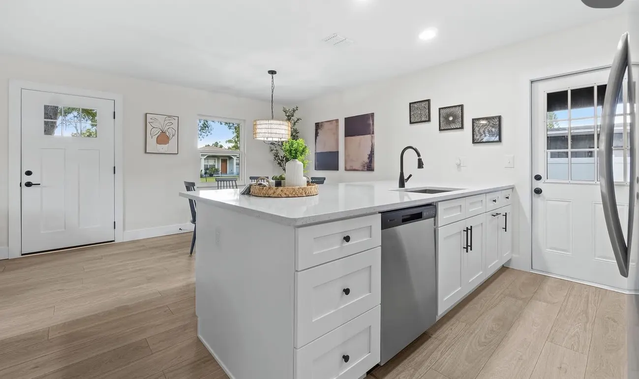 Open kitchen with island by CWL Construction